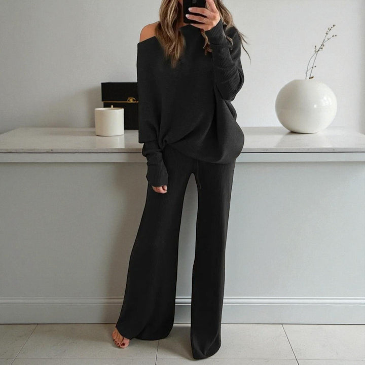 Front view of boat neckline and drawstring banded waist, black