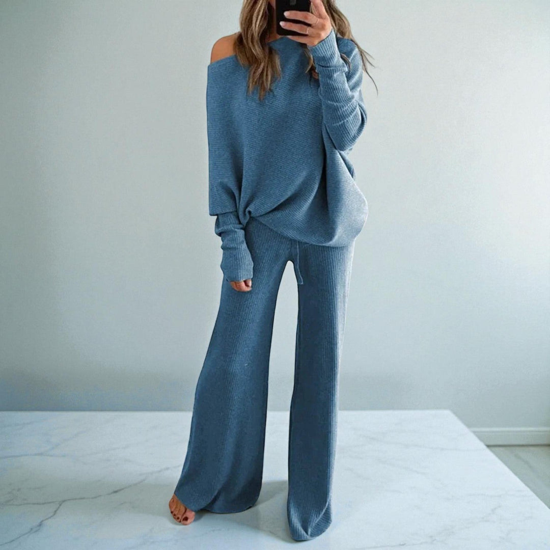 Front view of boat neckline, banded cuffs and wide legs, blue