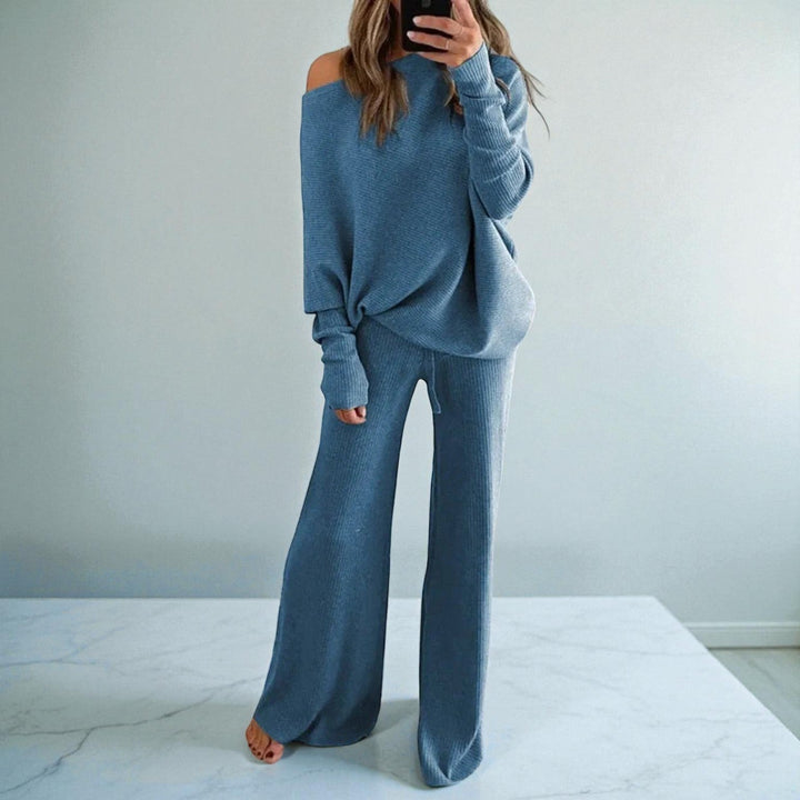 Front view of boat neckline, banded cuffs and wide legs, blue