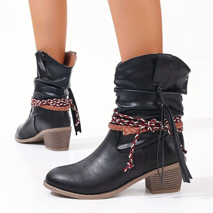 Back view with stacked block heels and braided wraps and tassels at the ankle