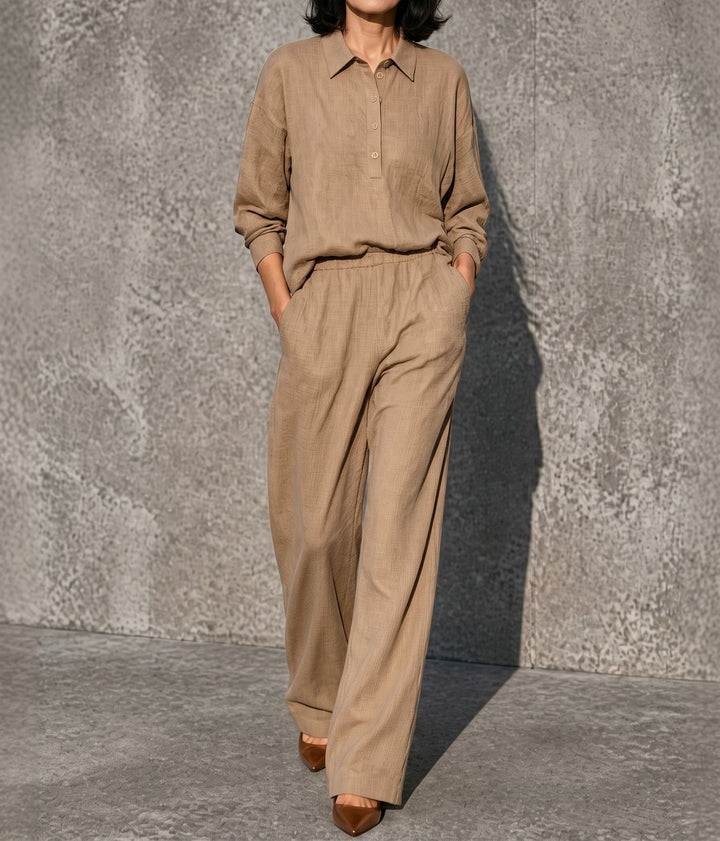 Front view showing long sleeves, side pockets and wide legs, khaki