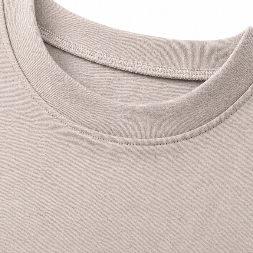 Detail of round neckline and stitched edging