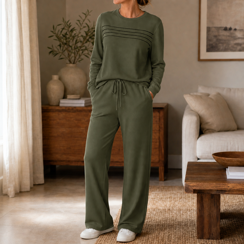 Front view of round neckline, pleated bodice and wide legs, dark green