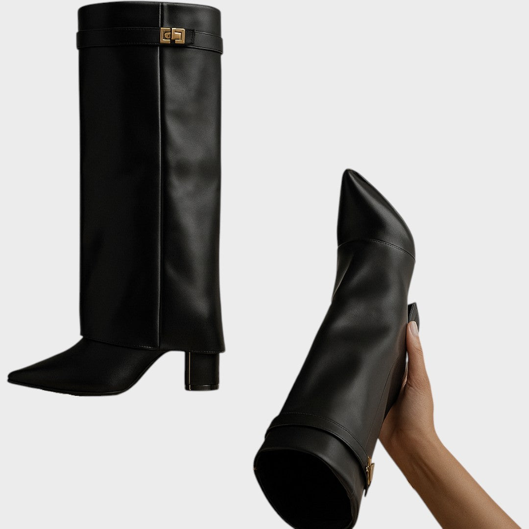 Front view of fold-over shaft, strap with twist-lock closure, pointed toe and wedge heel