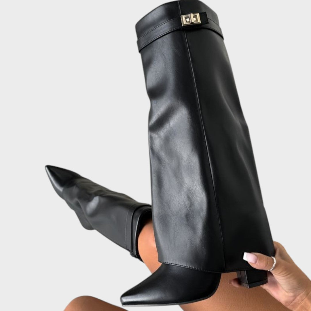 Side view of fold-over shaft, strap with twist-lock closure and pointed toe