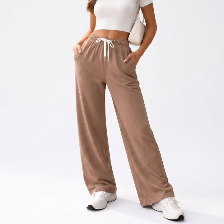 Front view showing drawstring waist, side pockets and wide legs, brown