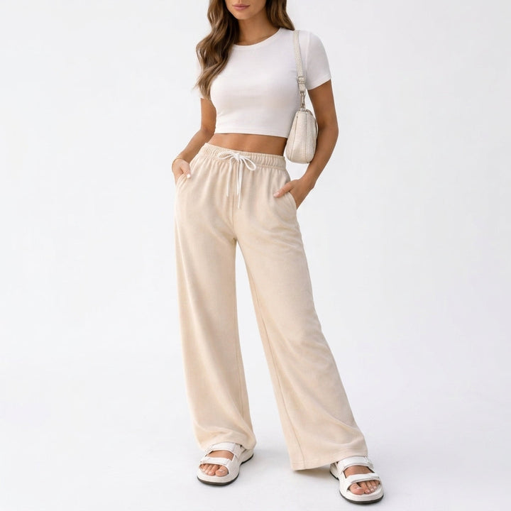 Front view showing drawstring waist, side pockets and full-length hem, cream