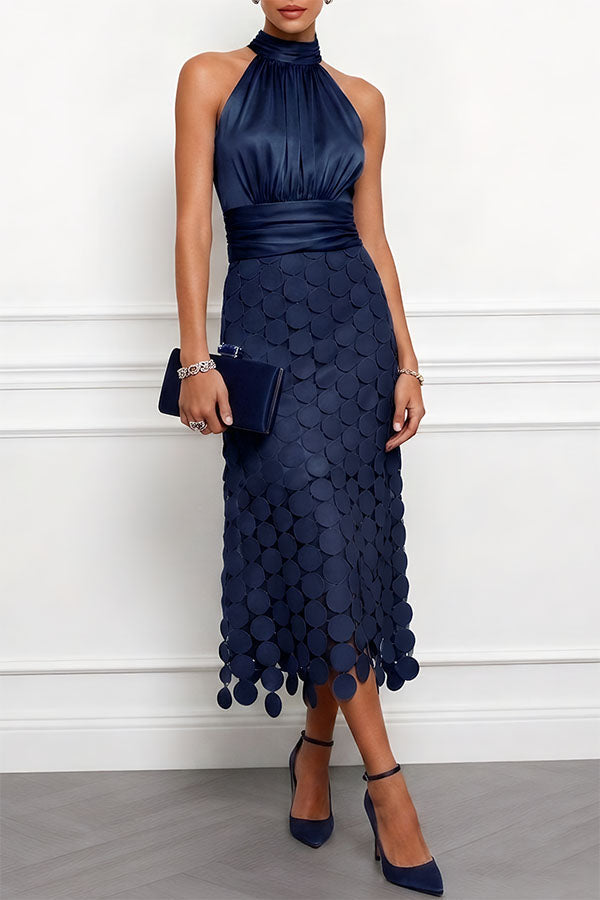 Front view showing halter neckline, banded waist and cutout skirt, navy blue