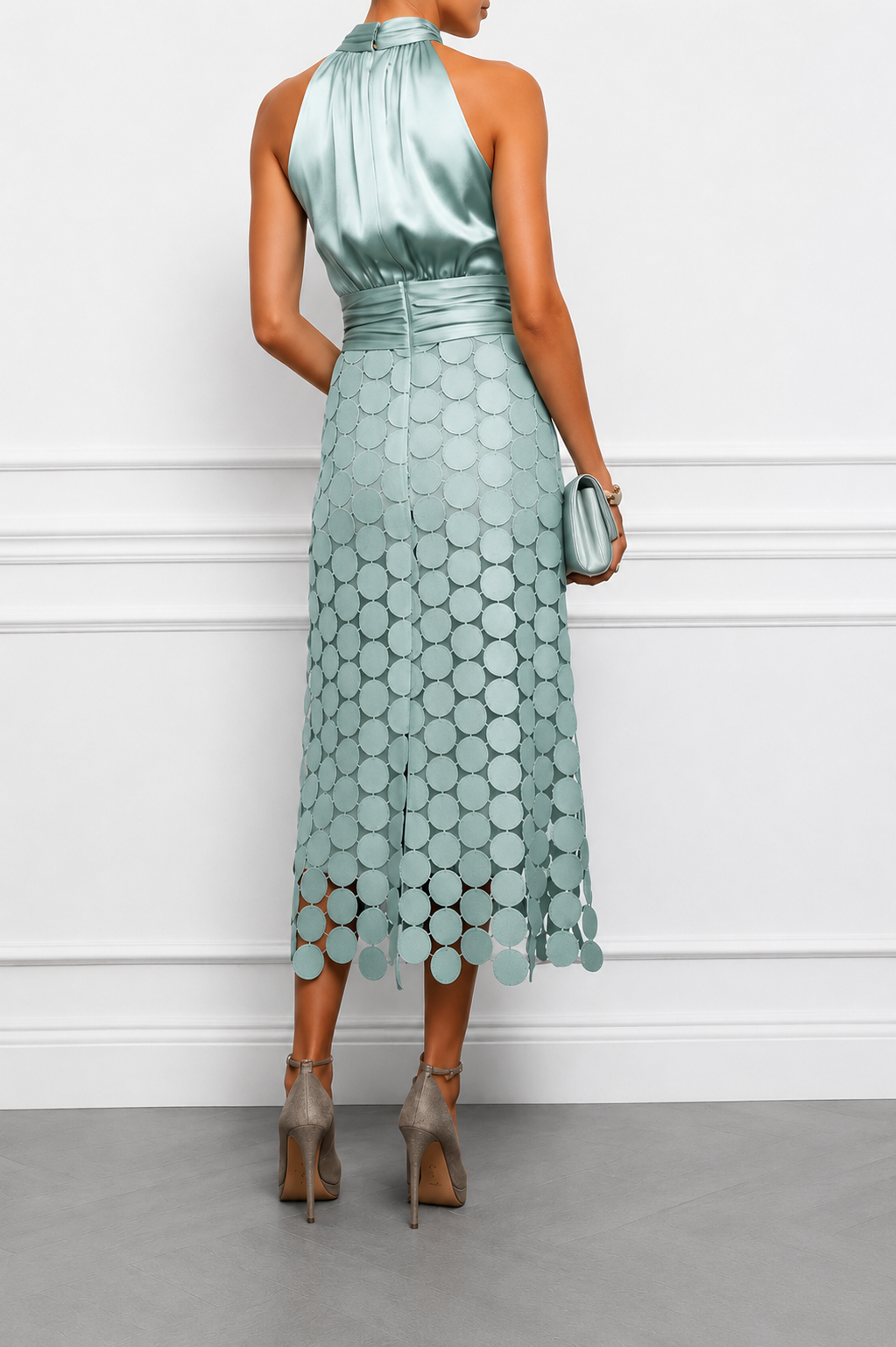 Back view showing open back, banded waist and cutout skirt