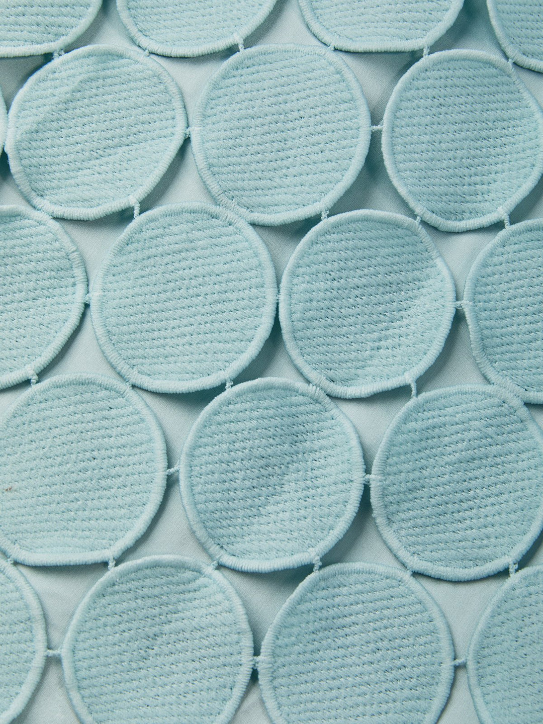 Detail view of the dress surface showing circle paillettes