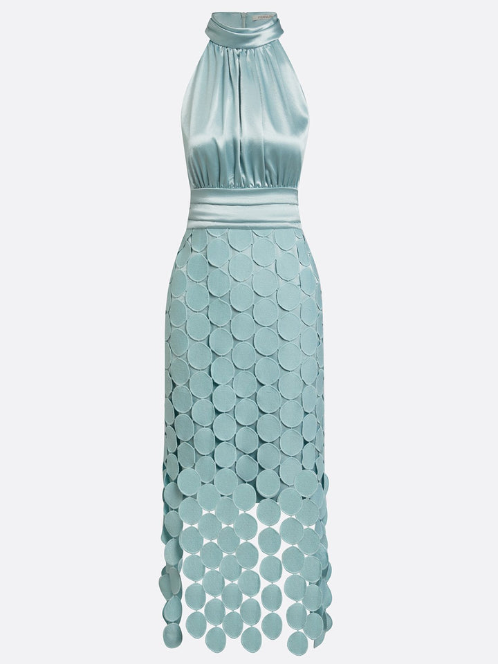 Front view showing halter neckline, ruched bodice and scalloped asymmetrical hem