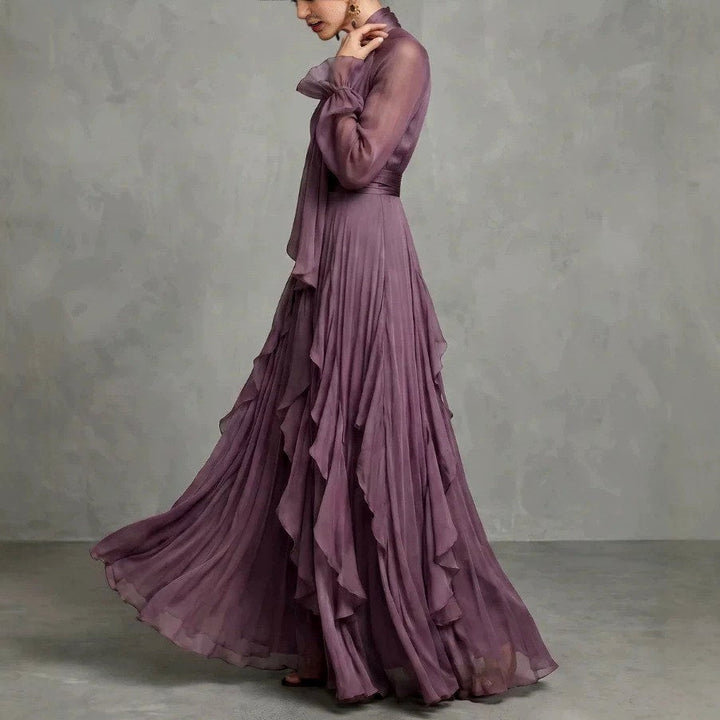 Side view of sheer long sleeves and ruffle layered skirt