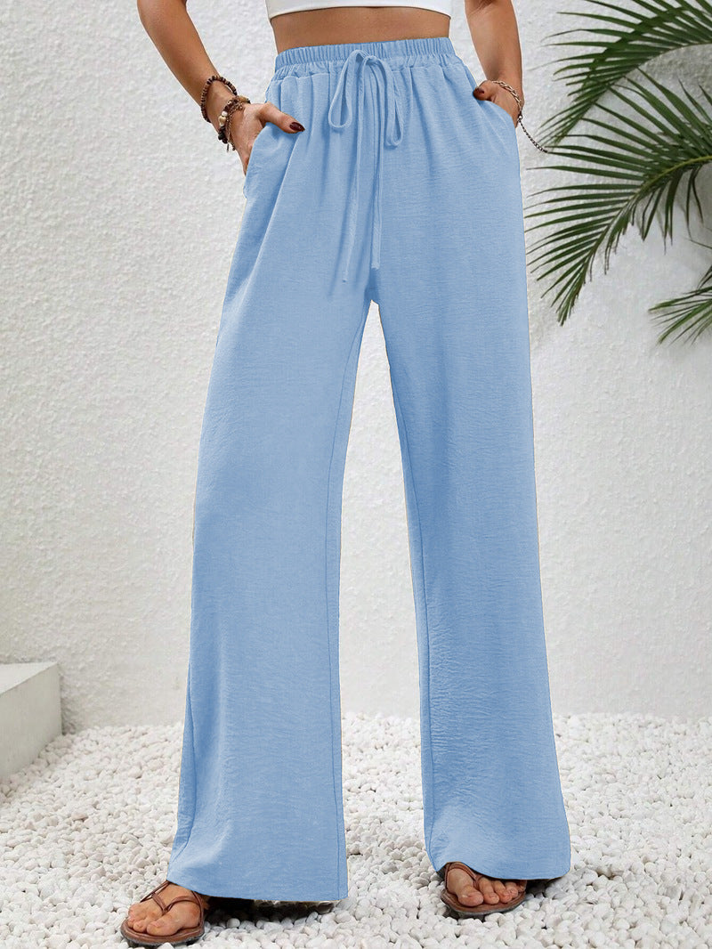 Front view of side pockets and full-length hem, light blue