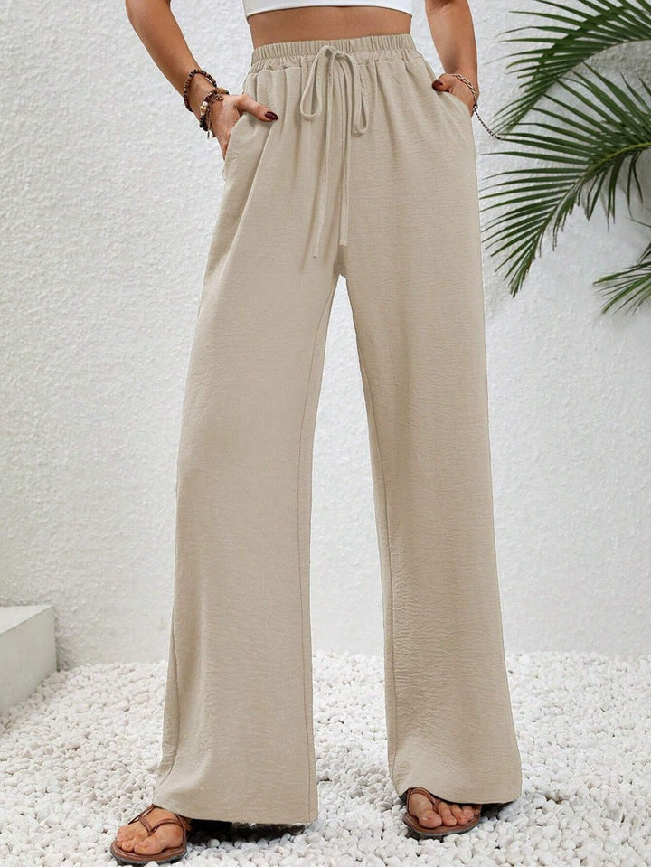 Front view of side pockets and wide legs, beige