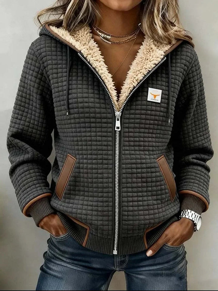 Front view showing hood, full-length zipper, side pockets and banded hem, dark gray