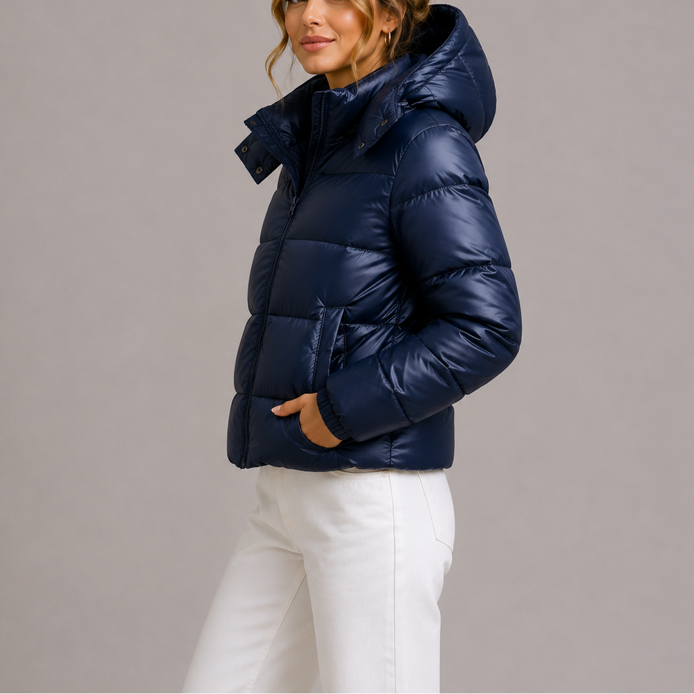 Side view showing the hood, stand collar and side pocket, navy