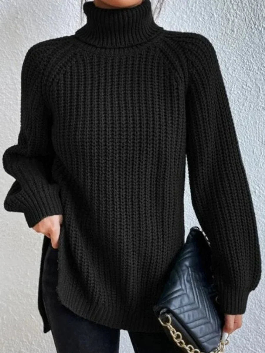 Front view of turtleneck sweater showing raglan sleeves, black