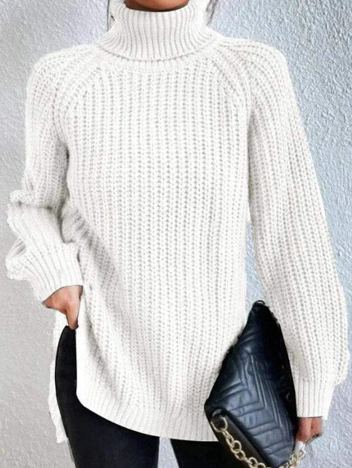 Front view of turtleneck sweater showing side slit, white