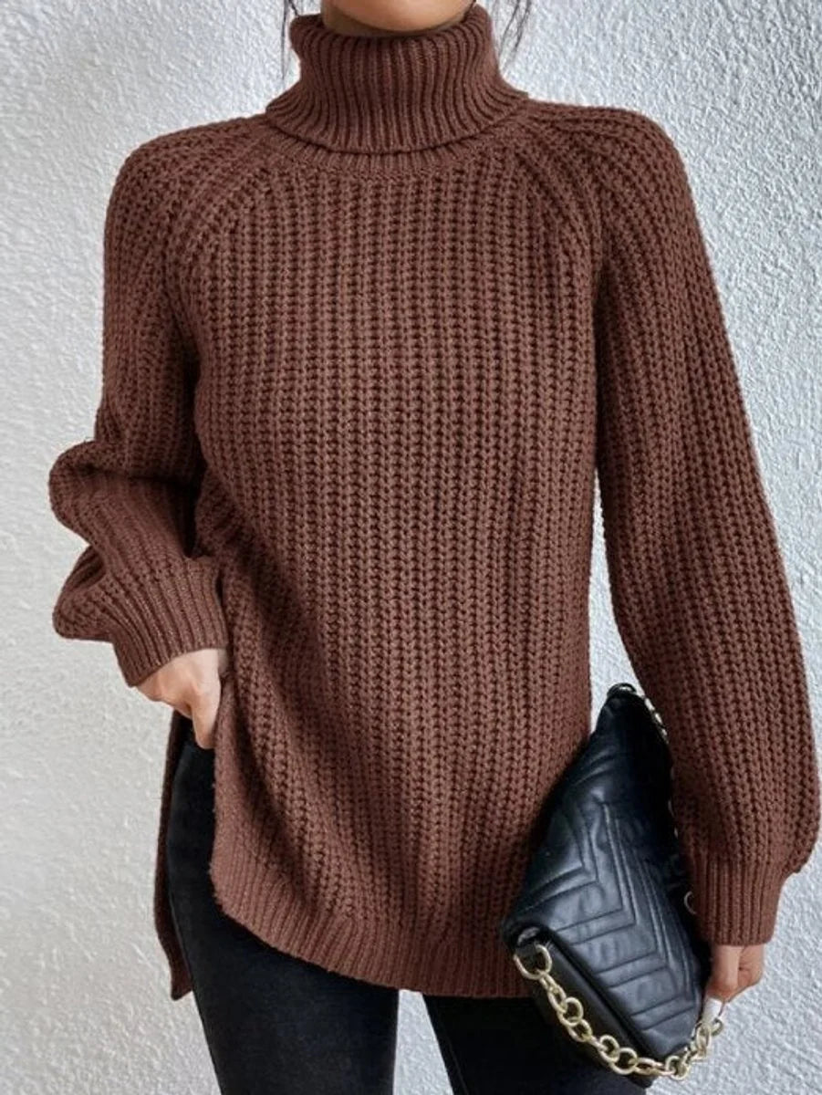 Front view of turtleneck sweater showing side slit, amber