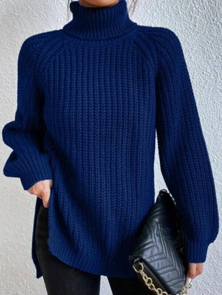 Front view of turtleneck sweater showing hip-length hem, navy blue
