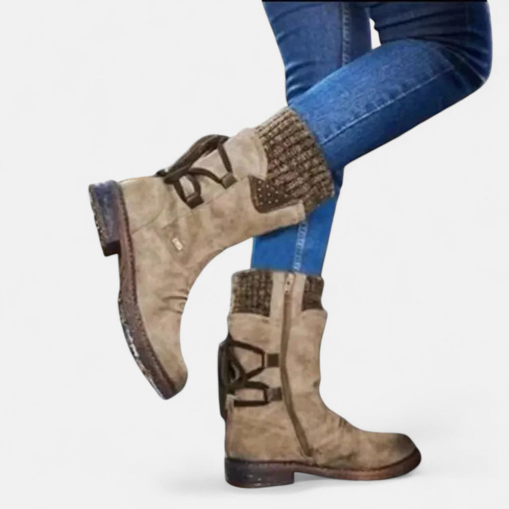 Front view showing ribbed cuff, studded panel and side zipper