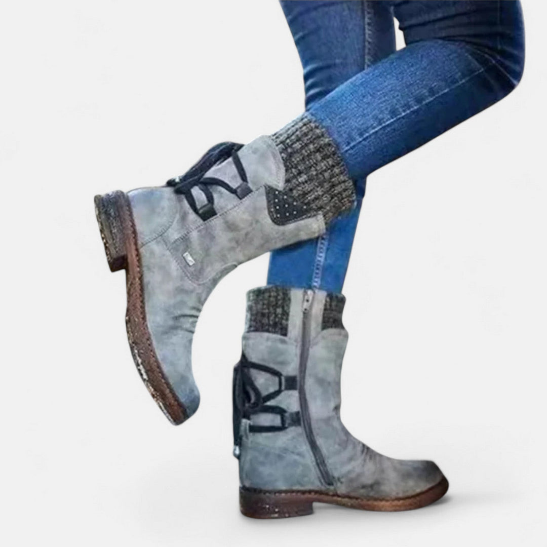 Front view showing side zipper, studded panel and ribbed cuff, gray
