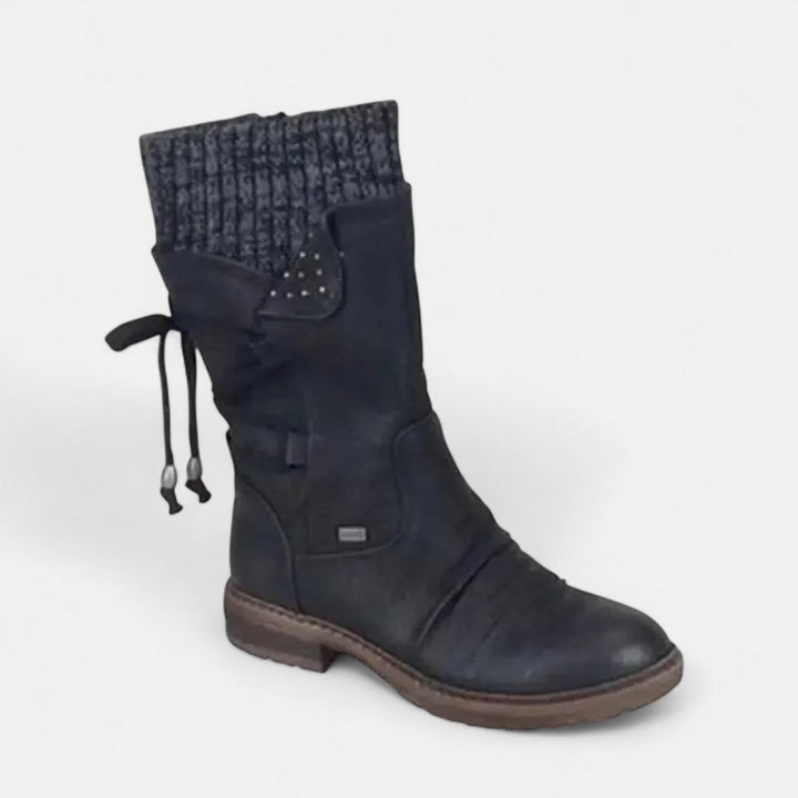 Front view showing ribbed cuff, lace-up back and traction sole, black