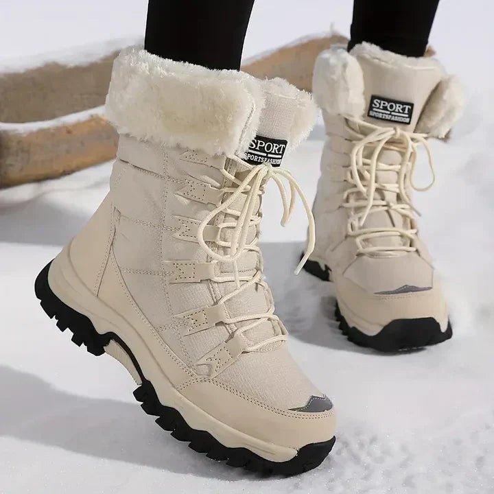 Front view showing lace-up front, fold-over collar and lugged sole, beige