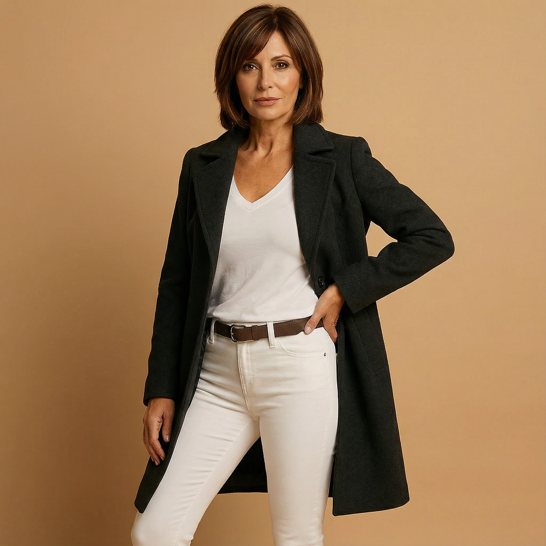 Front view showing lapels, long sleeves and button closure, black