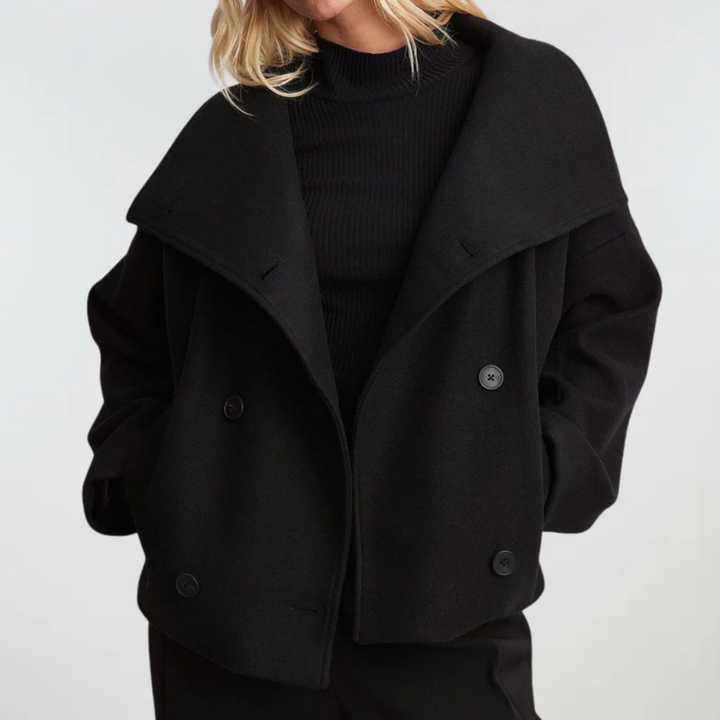 Front view of cropped pea coat with wide lapels, collared neckline and double-breasted buttons, black