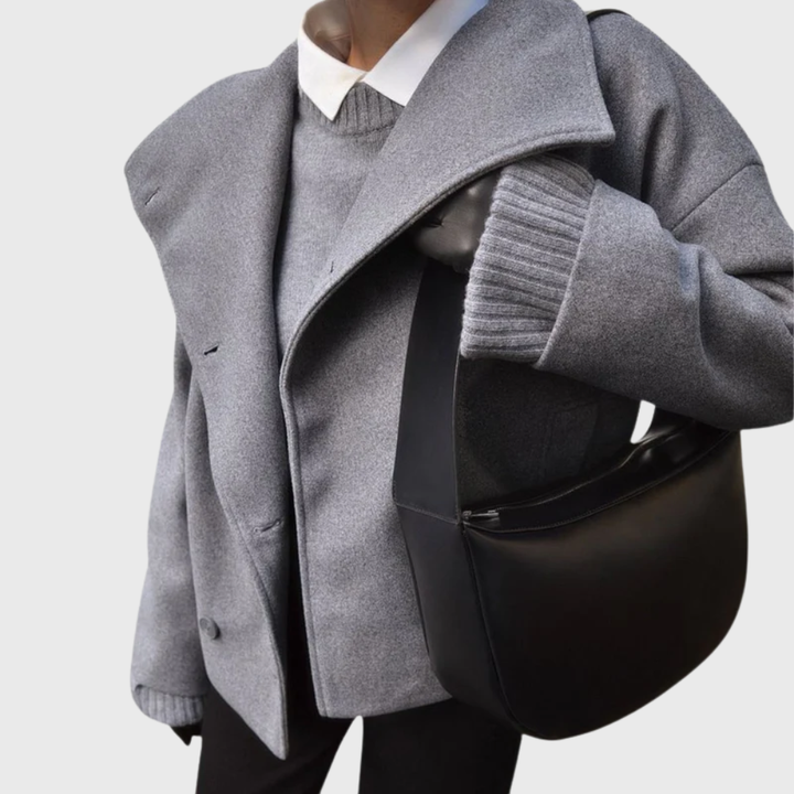 Side view showing wide lapels, long sleeve and side pocket, dark gray