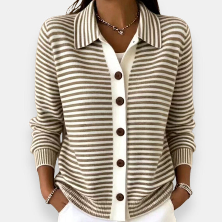 Front view showing shirt collar, button placket and banded cuffs, brown