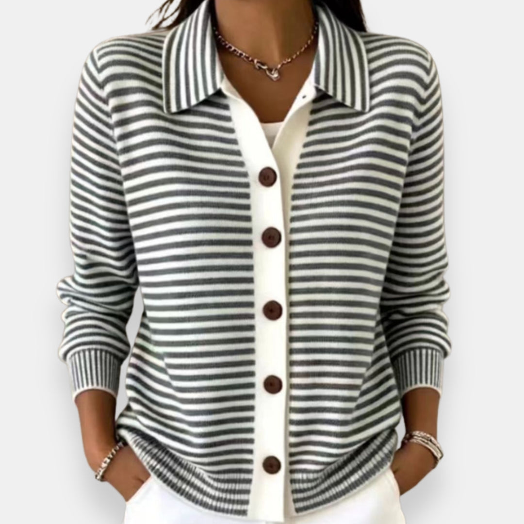 Front view showing shirt collar, long sleeves and button placket, black