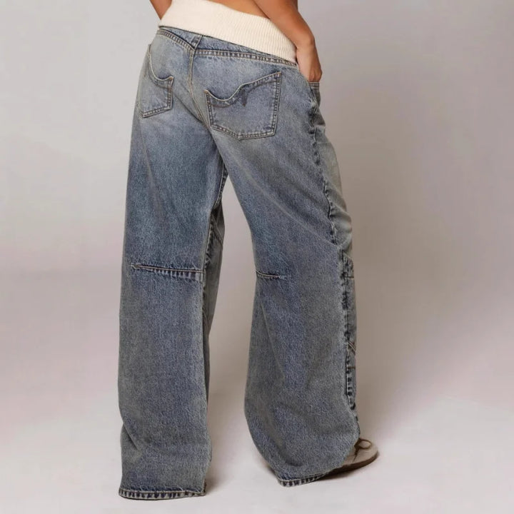 Back view of wide leg jeans with patch pockets and stitched panels