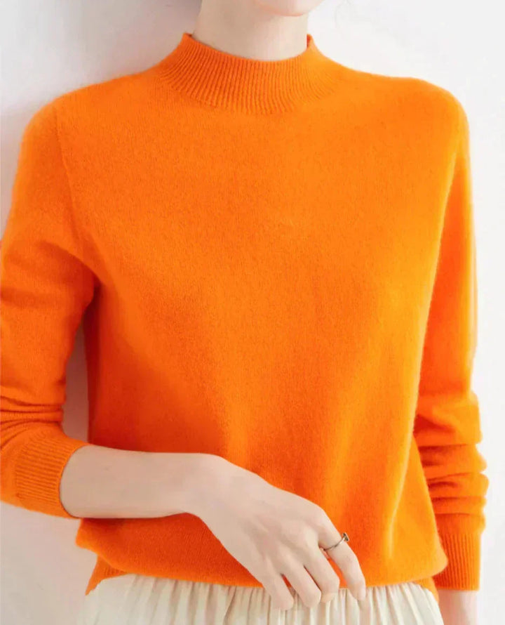Front view of mock neckline and ribbed cuffs, orange