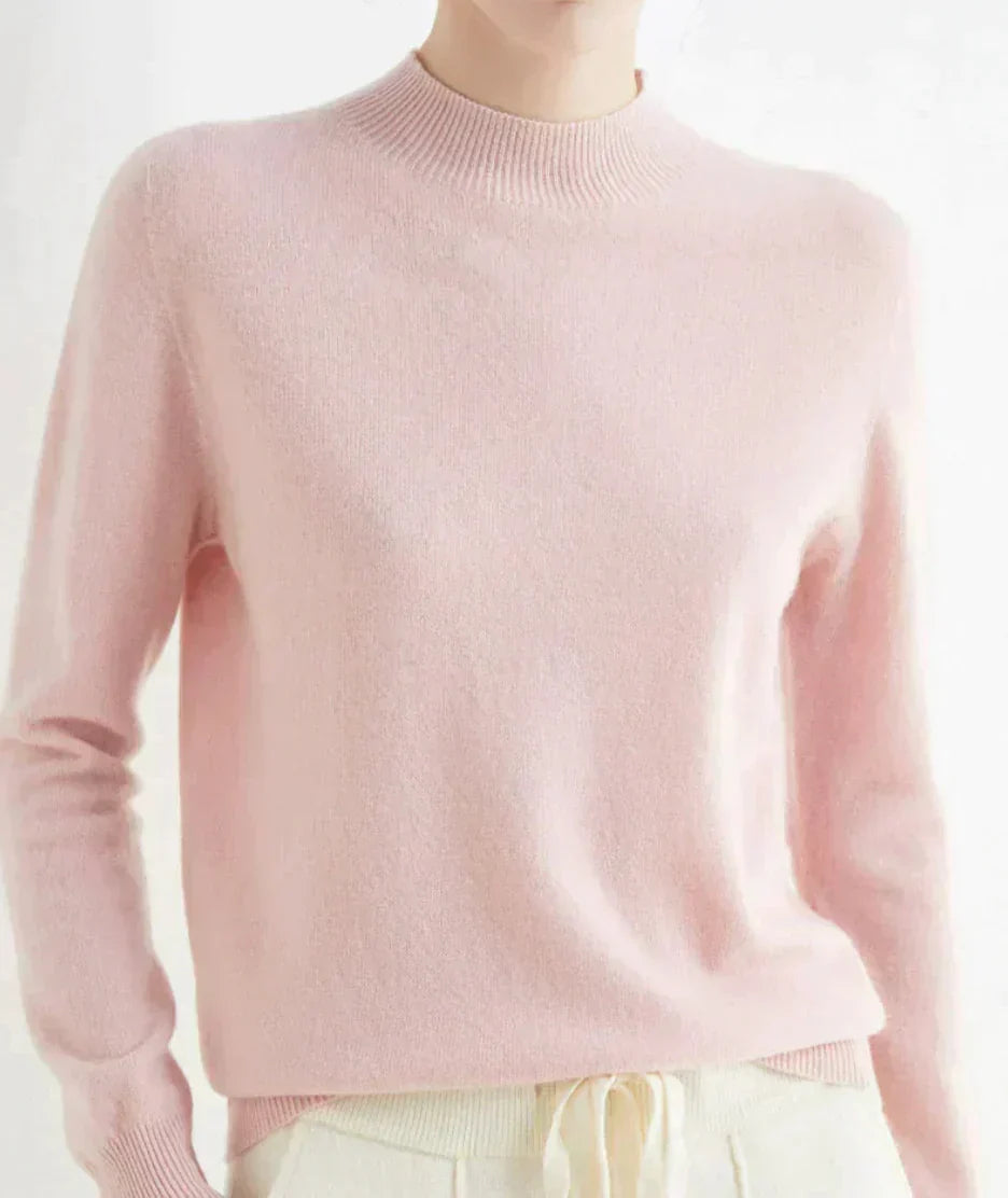 Front view of mock neckline and long sleeves, pink