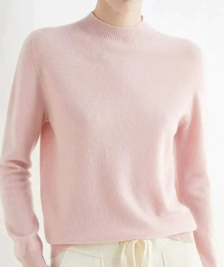 Front view of mock neckline and long sleeves, pink
