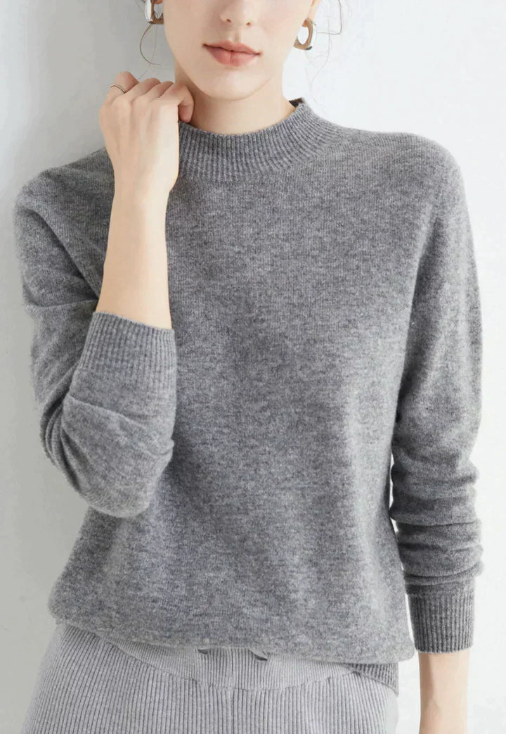 Front view of mock neckline and ribbed cuffs, gray
