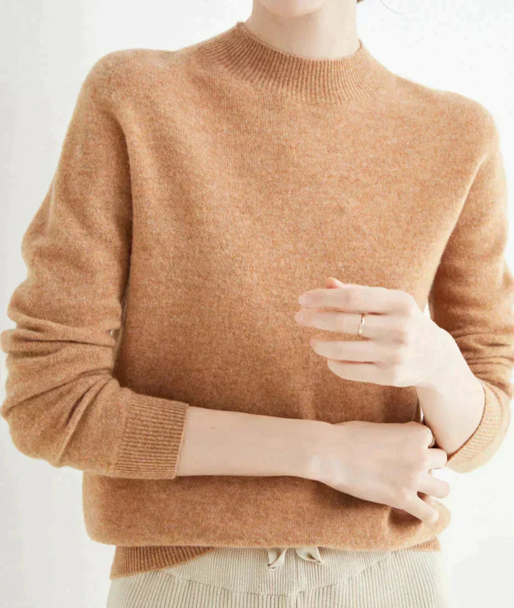 Front view of mock neckline and long sleeves, light brown