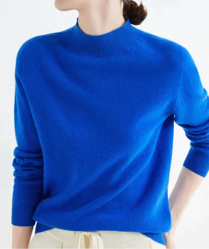Front view of mock neckline and long sleeves, blue