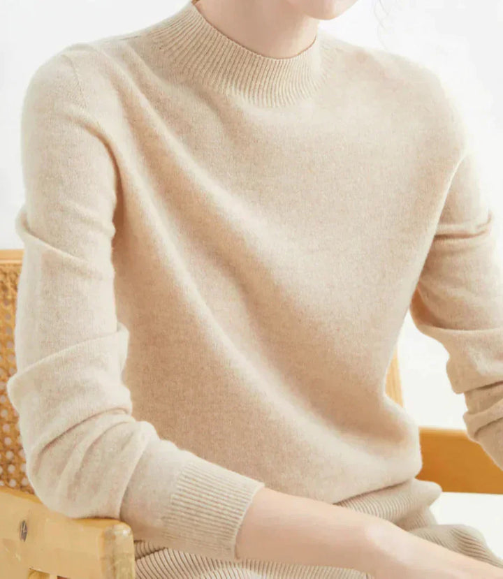 Side view of mock neckline and ribbed cuffs, beige