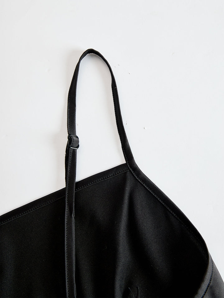 Detail view of adjustable spaghetti strap and sweetheart neckline of camisole