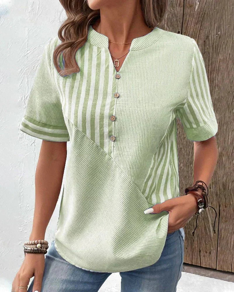Front view showing notched neckline, button placket and short sleeves, green