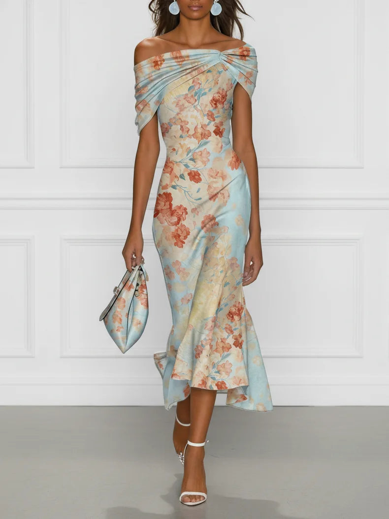 Front view of off-shoulder neckline, twisted bodice and ruffle hem, blue