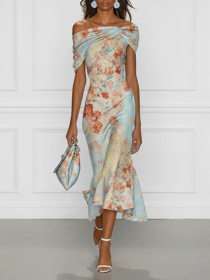 Front view of off-shoulder neckline, twisted bodice and ruffle hem, blue