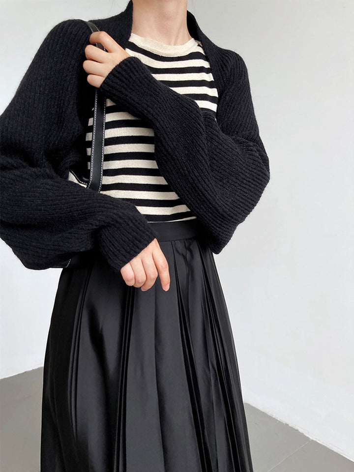 Front view of long sleeves and ribbed cuffs, black