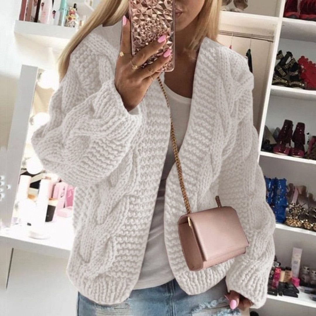 Front view of open front cardigan with cable knit body, white