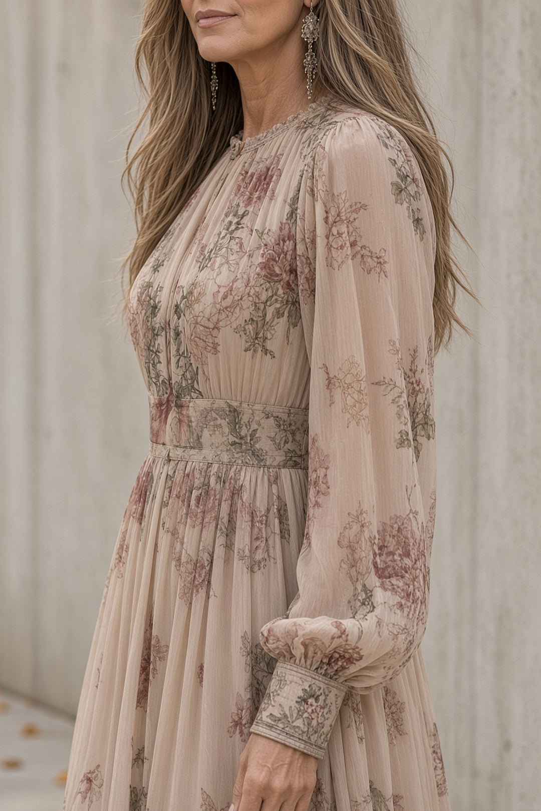 Side view showing gathered neckline, long sleeve, banded cuff and banded waist
