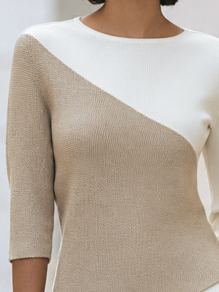 Detail view of round neckline and diagonal color-block panels