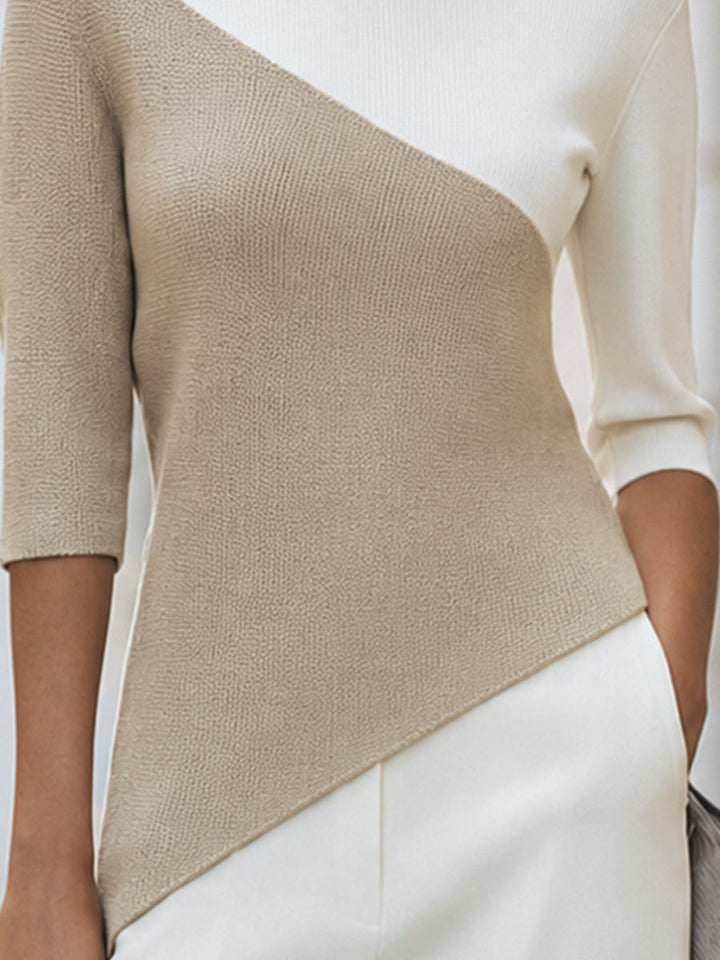 Detail view of color-block panels and asymmetric hem